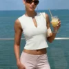 Sc5612037d9f04c75bdb0dc192d1a73b04.webp Hugcitar 2026 Women Fashion Pure Color V Neck Sexy Slim Crop Tank Top Spring Summer Female Clothes Beach Vacation Club