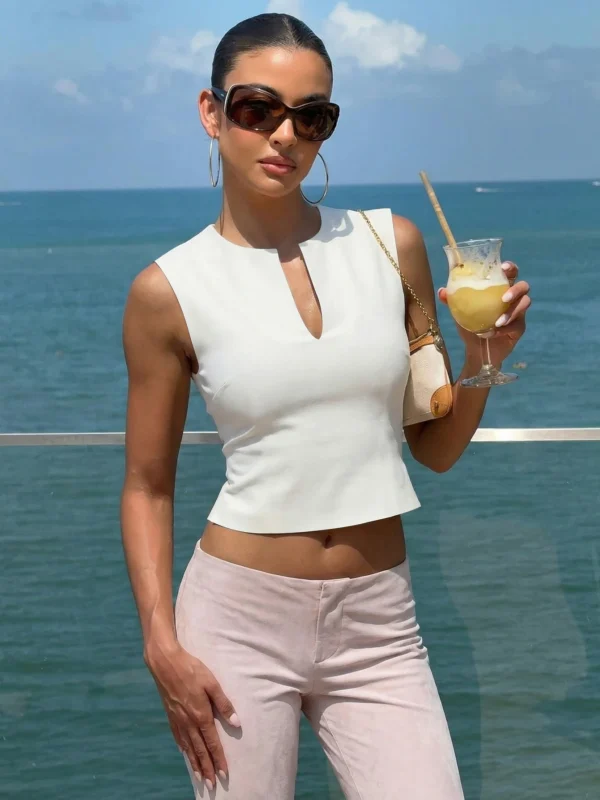 Sc5612037d9f04c75bdb0dc192d1a73b04.webp Hugcitar 2026 Women Fashion Pure Color V Neck Sexy Slim Crop Tank Top Spring Summer Female Clothes Beach Vacation Club